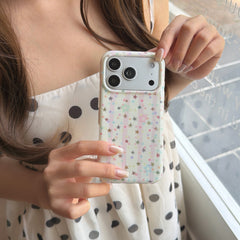 Close-up view of a woman holding an aesthetic pastel pink stripe phone case with a matte silver camera frame.