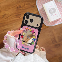 An aesthetic view of the pink Tamagotchi character mirror phone case held next to a pink canvas bag.