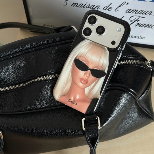 Y2K blonde girl iPhone case displayed on a black leather handbag.