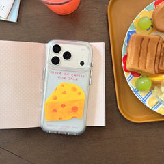 Cheese graphic clear iPhone case beside cafe dessert tray