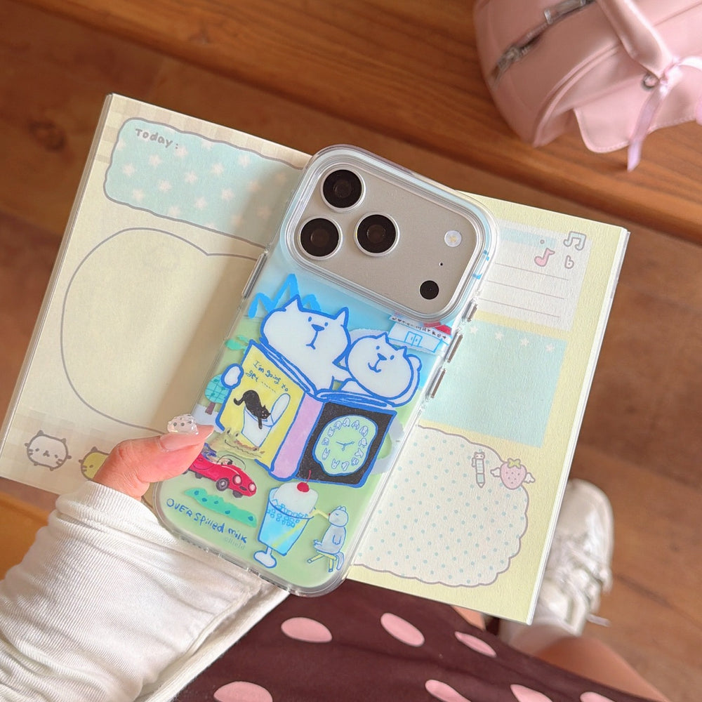 A clear smartphone cover with a playful hand-drawn kitten design held over a colorful memo pad.