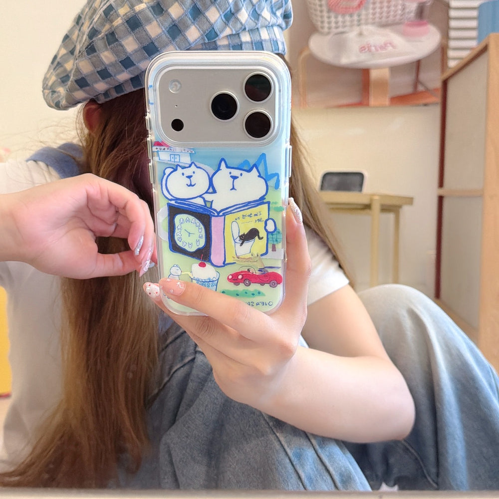Mirror selfie of a girl wearing a blue plaid beret hat, showcasing a funny cartoon cat clear phone cover.