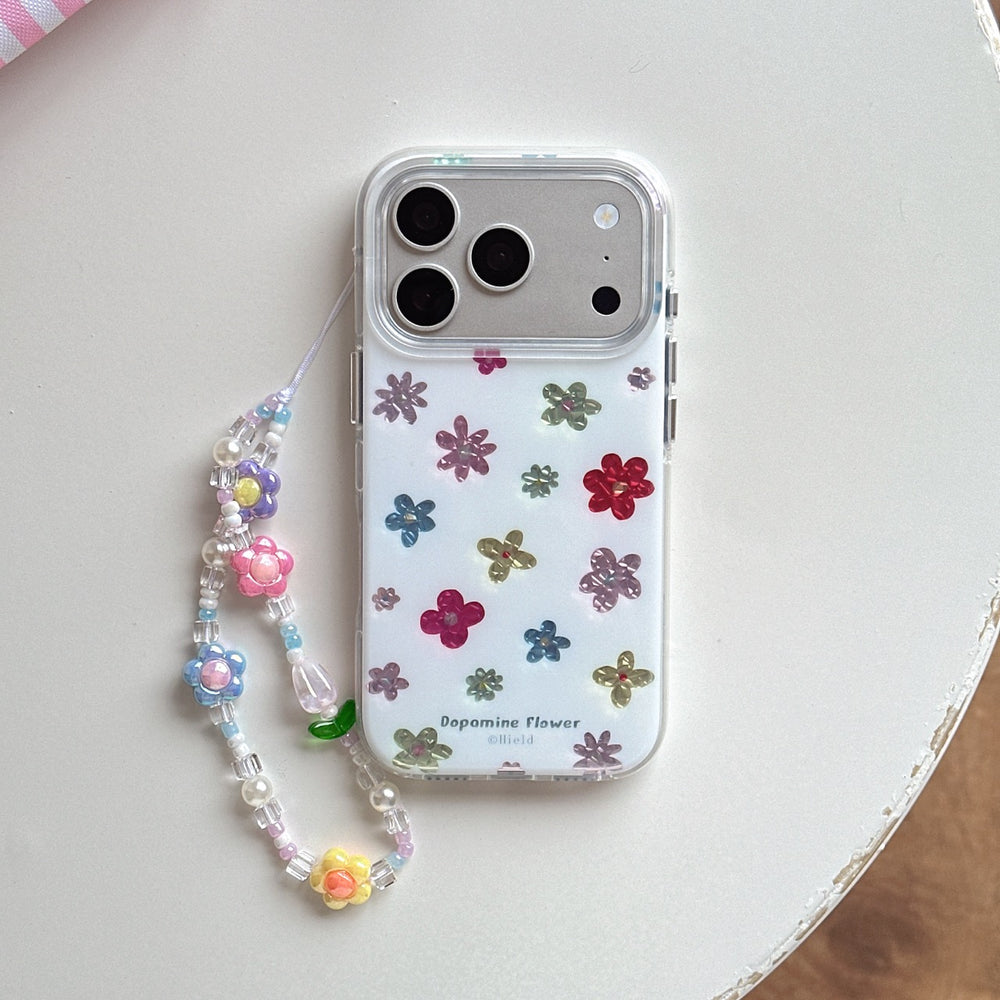 Top view of a clear dopamine flower phone case with a silver camera frame and colorful beaded strap on a white background.