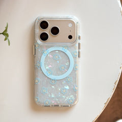 Product shot of an isolated iridescent pearl-texture phone case with blue flower print and a matching 3D flower phone stand.
