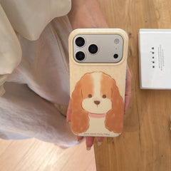 Top view of a fluffy puppy iPhone case held over a wooden floor.