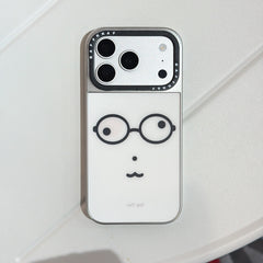 Studio product view of a funny nerd glasses face iPhone case with a silver camera frame on a clean white surface.