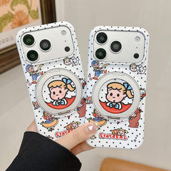 A hand holding two matching Japanese cartoon polka dot iPhone cases with silver built-in ring stands.