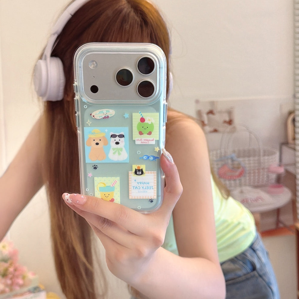 A girl taking a mirror selfie with a mint green iPhone case featuring cute cartoon dog and cat stickers.