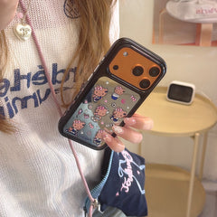 A woman holding a cute Hello Kitty mirror iPhone case with a vibrant orange camera protection frame.