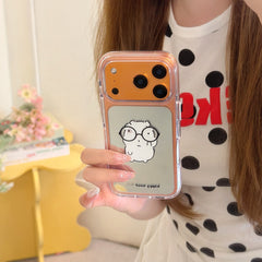 Mirror selfie displaying an orange metallic camera bumper nerd glasses animal mirror phone case.