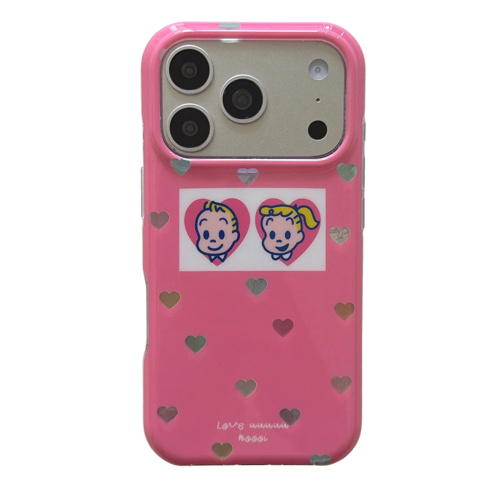 A flat lay view of a kawaii Osamu Goods rose pink heart iPhone case with a matte silver camera plate.