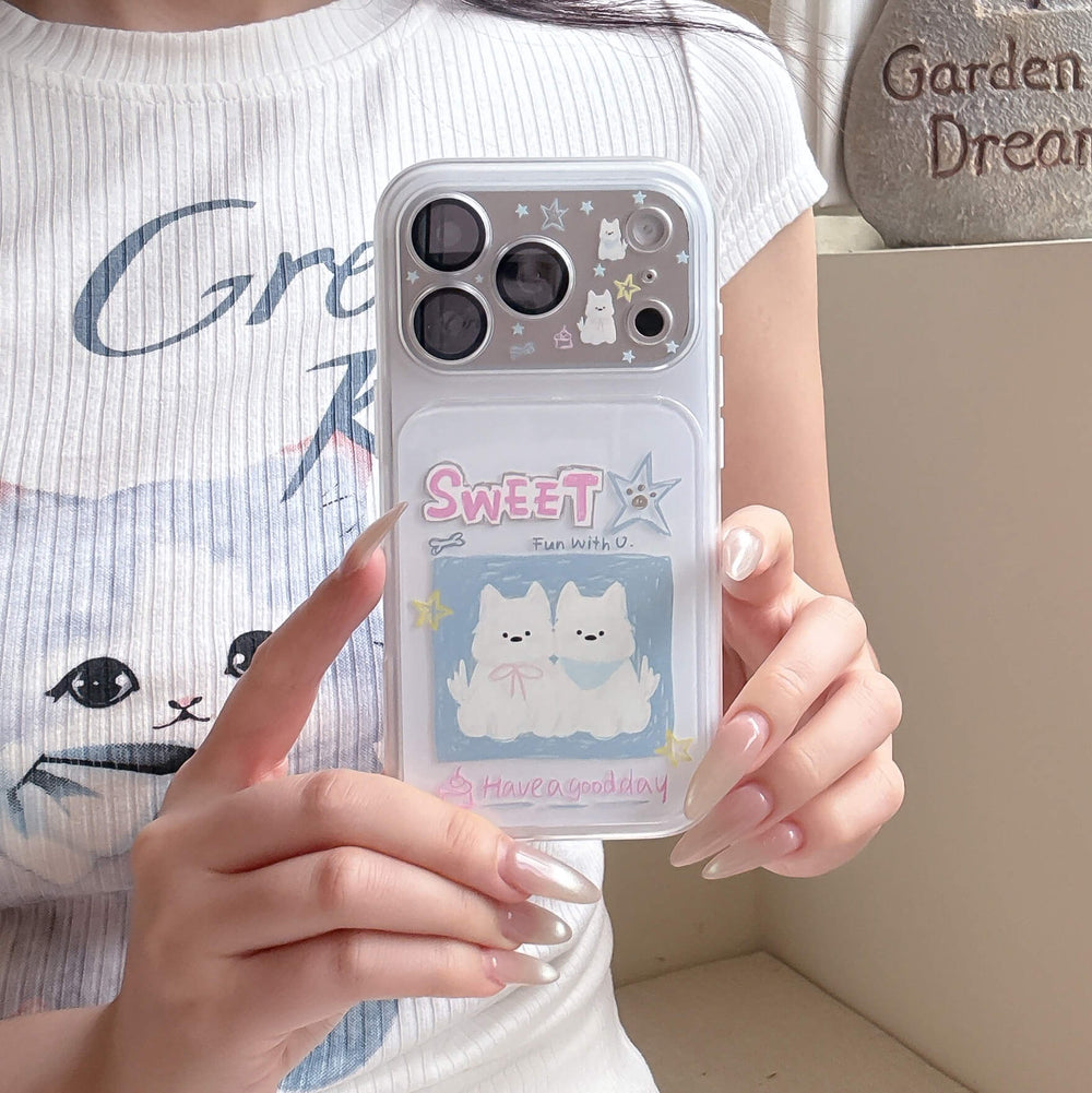 A girl holding a clear shockproof phone case with kawaii white puppy prints over a casual graphic tee.