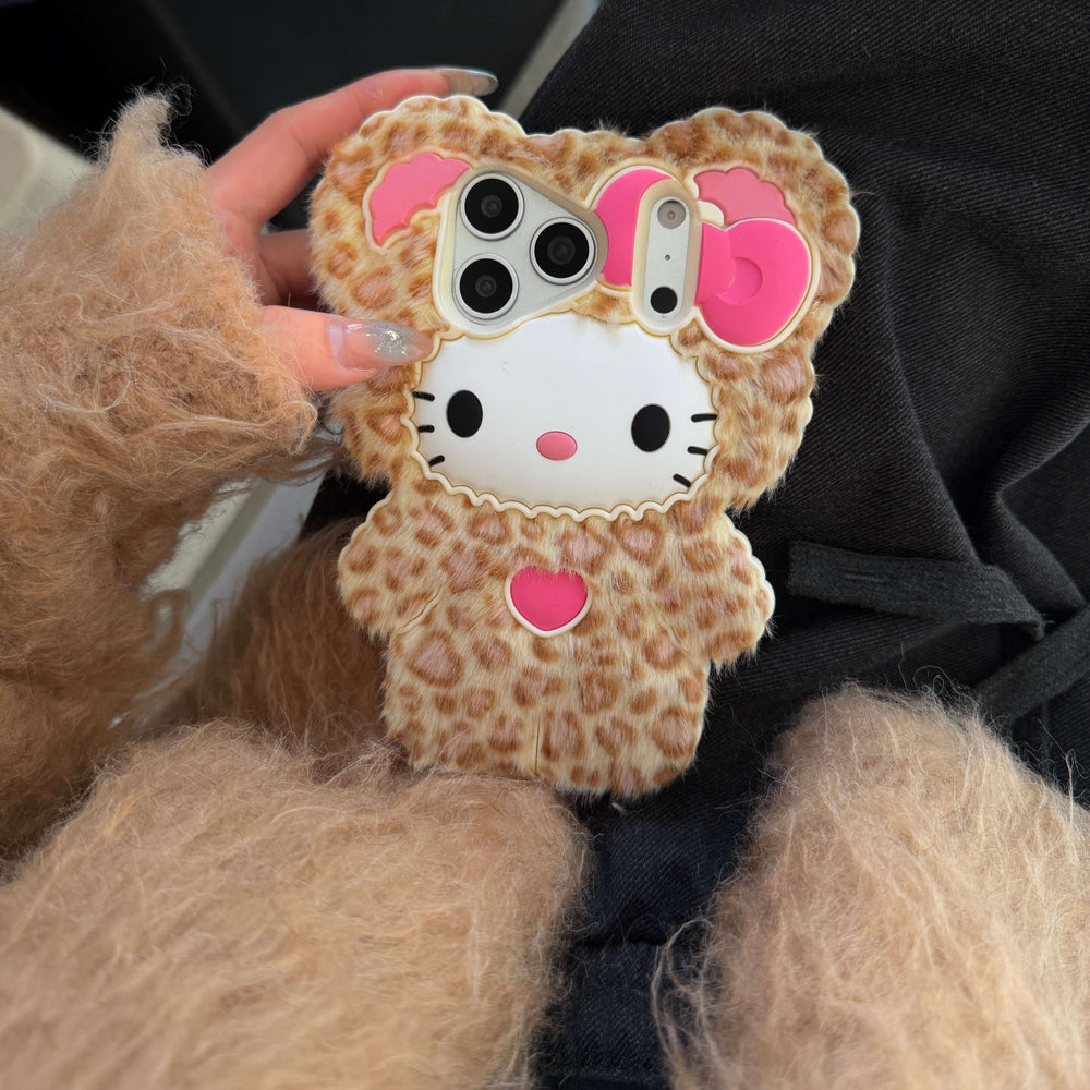 Hand holding a leopard kitty faux fur iPhone case with a 3D pink bow