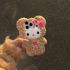 Leopard kitty plush iPhone case held outdoors in warm sunlight