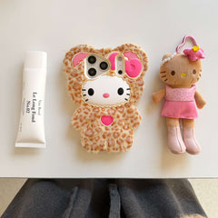 Leopard kitty plush iPhone case with pink bow, heart detail and faux fur in a flat lay
