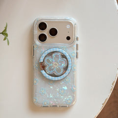 Product shot of an isolated clear magnetic iphone case with a built-in light blue MagSafe circle and aesthetic flower patterns.