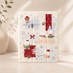 A stylish minimalist studio shot of a cute winter Miffy bunny iPad case standing vertically on a light countertop next to a white decorative ceramic vase.