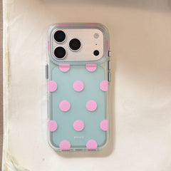 Mint green and pink polka dot clear iPhone case on white background
