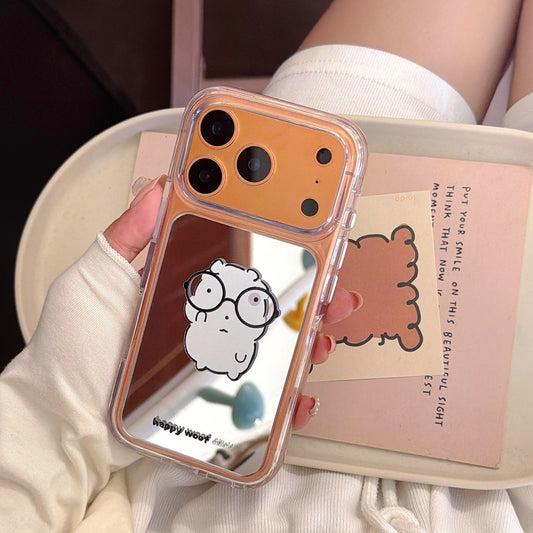An orange metallic lens mirror phone case featuring a cartoon graphic resting on an aesthetic book.
