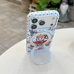 The cute polka dot cartoon iPhone case standing vertically on a table supported by its ring kickstand.