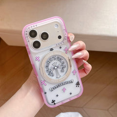 Vertical view of a punk Chrome Hearts style pink jelly cross phone case held by hands.