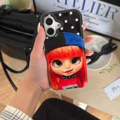 Glossy red-haired doll iPhone case held in a Y2K lifestyle setting.