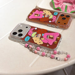 Two Y2K aesthetic cartoon dog phone cases in silver and orange metallic frames lying flat on a white table.