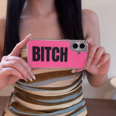 A girl holding a bold hot pink typography phone case horizontally in front of her outfit.