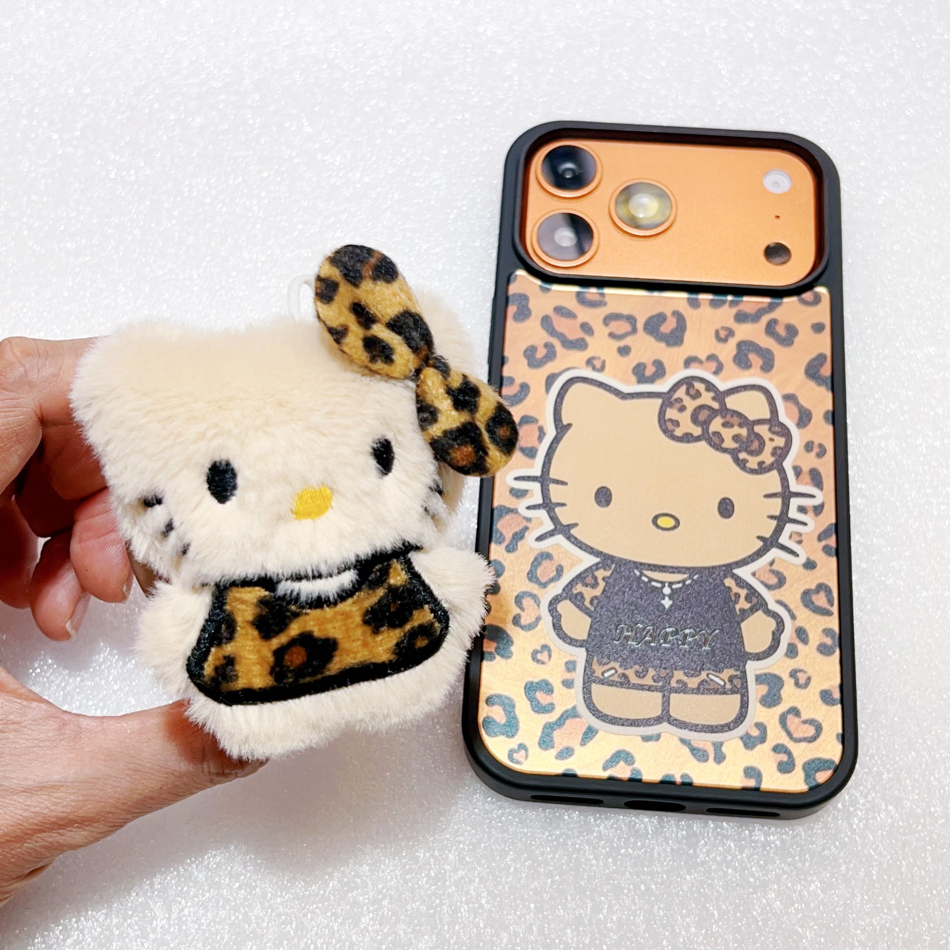 Leopard print Hello Kitty magnetic phone case for iPhone 17