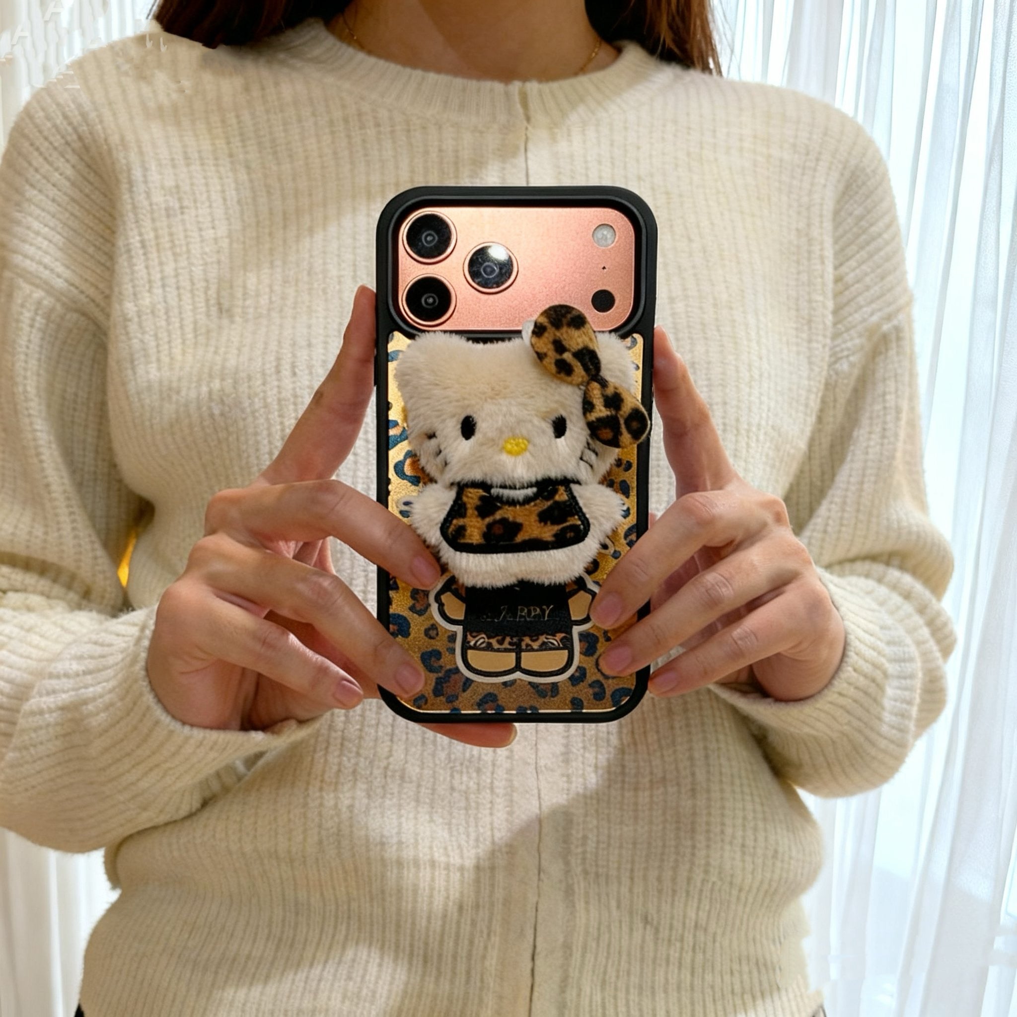 Leopard print Hello Kitty magnetic phone case for iPhone 17