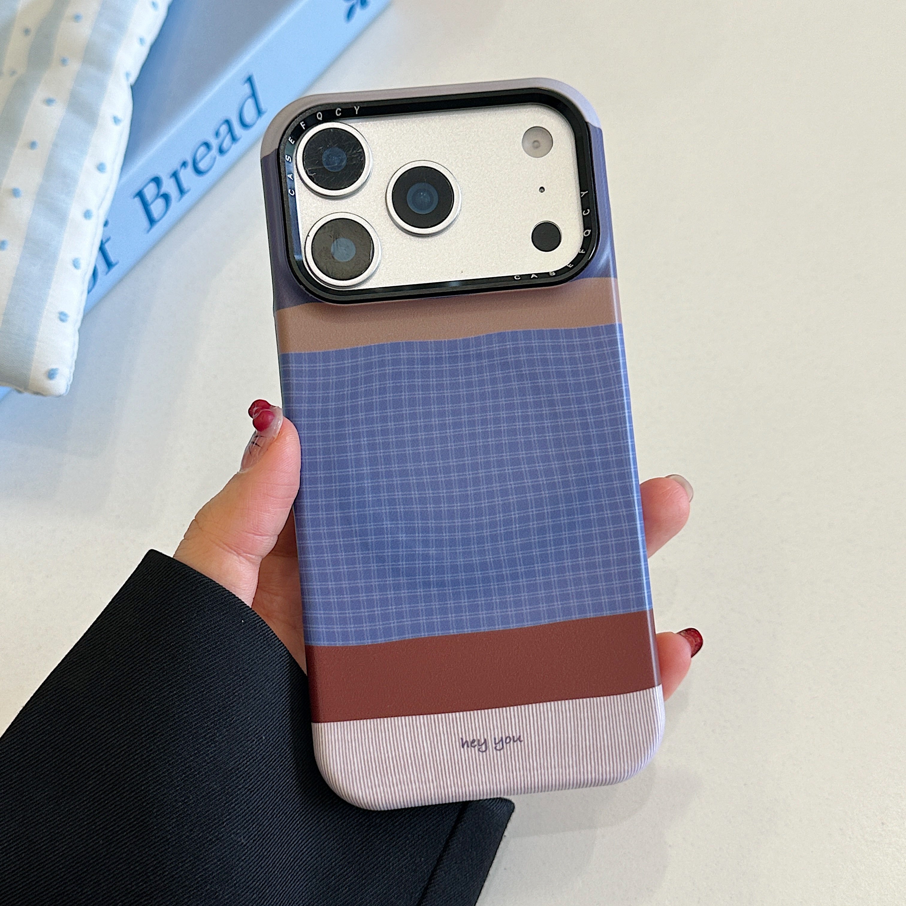 Brown, blue, and white striped phone case with magnetic stand