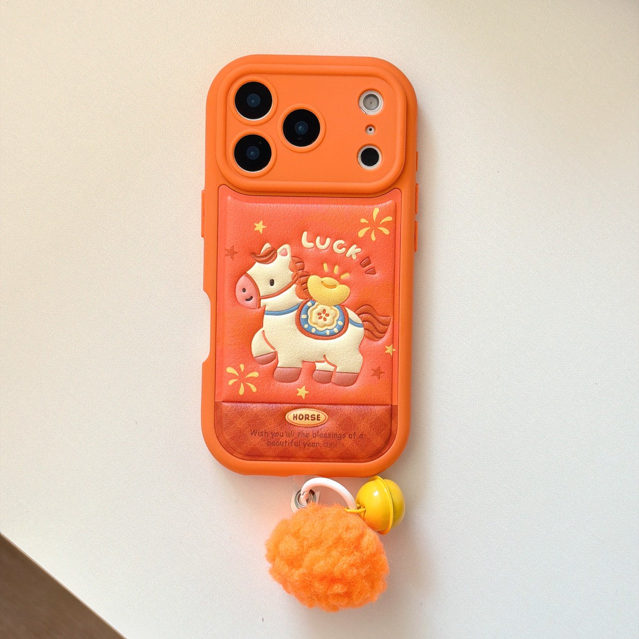 Orange-based 3D Apple phone case with gold ingot and pony design