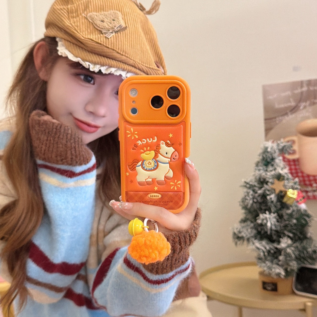 Orange-based 3D Apple phone case with gold ingot and pony design