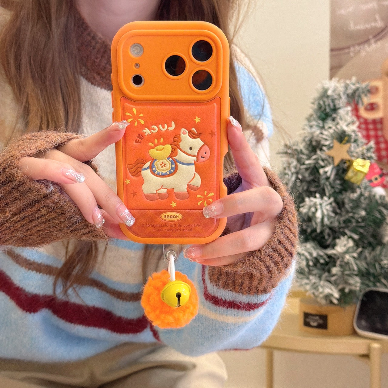 Orange-based 3D Apple phone case with gold ingot and pony design