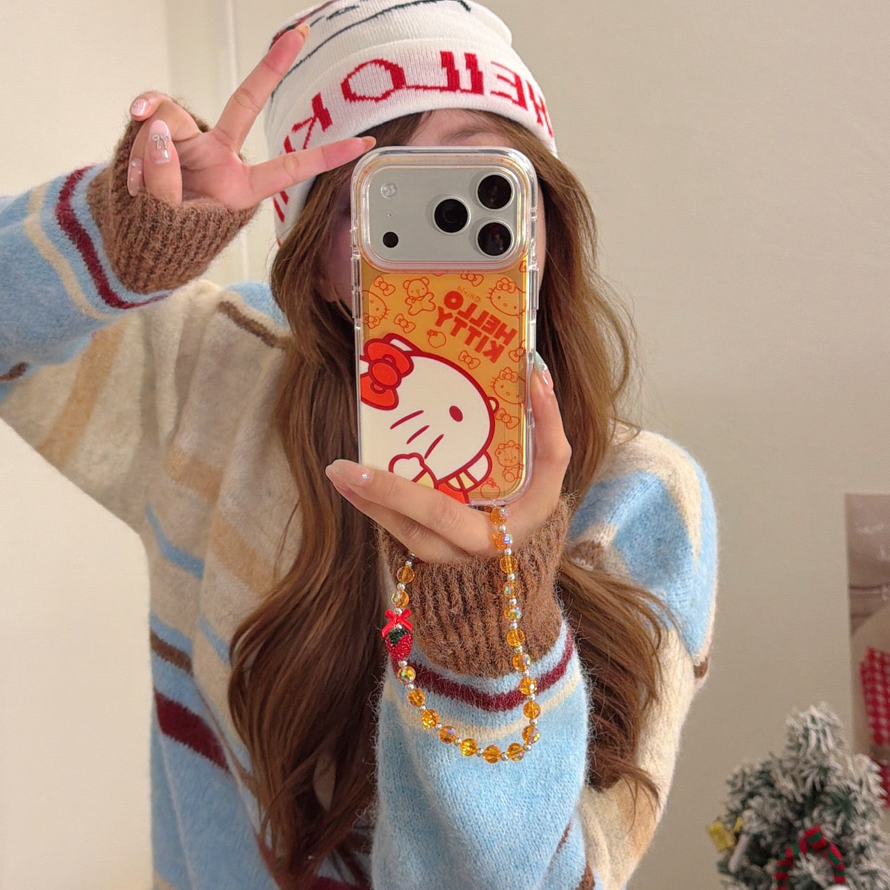 Orange-toned Kitty side profile rounded airbag phone case