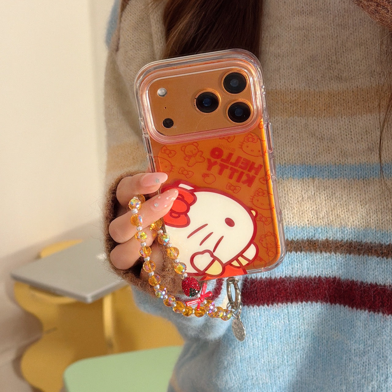 Orange-toned Kitty side profile rounded airbag phone case