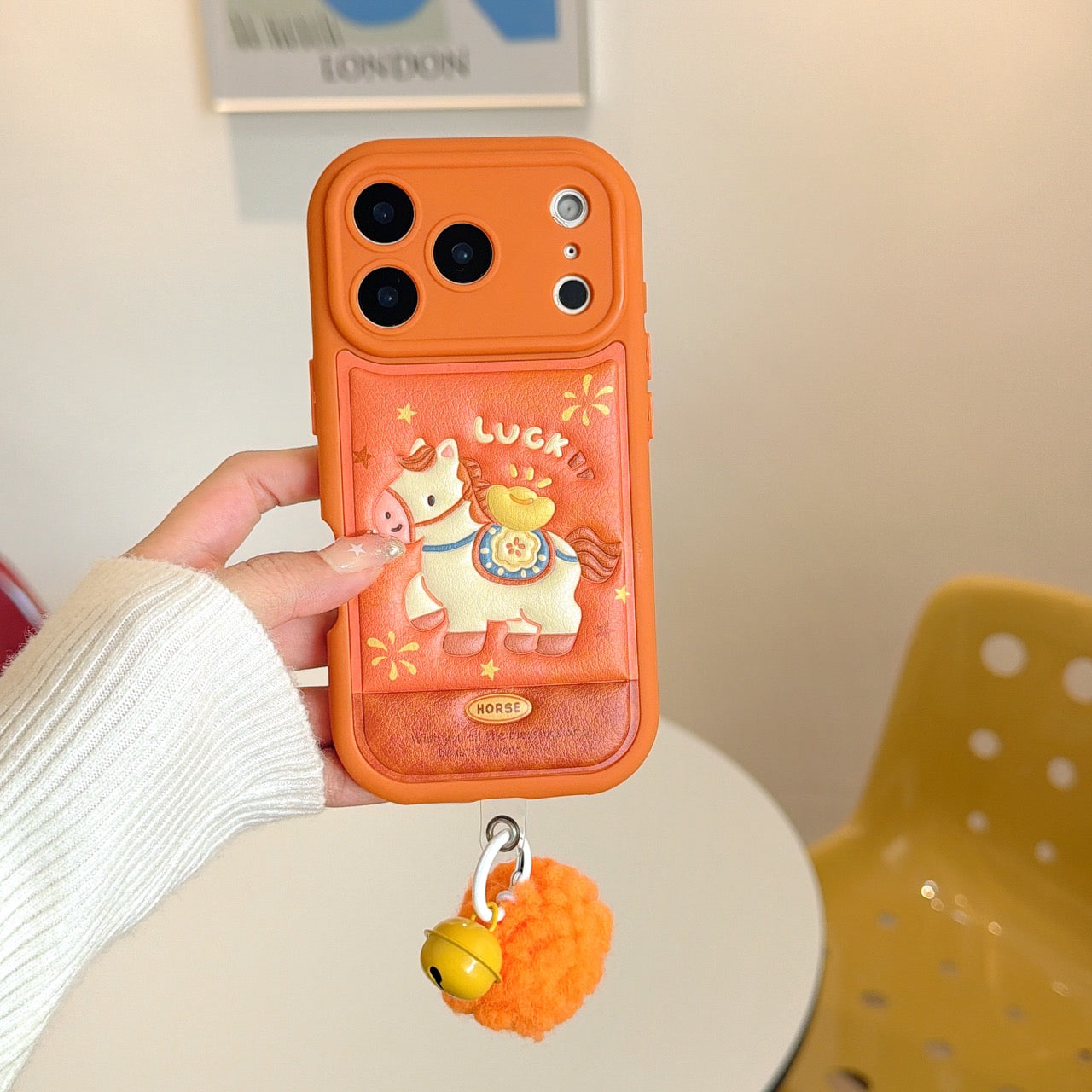 Orange-based 3D Apple phone case with gold ingot and pony design