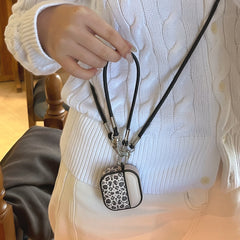 Color-blocked black leopard print magnetic drum-shaped earphone case