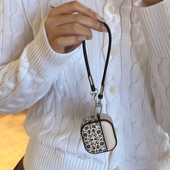 Color-blocked black leopard print magnetic drum-shaped earphone case