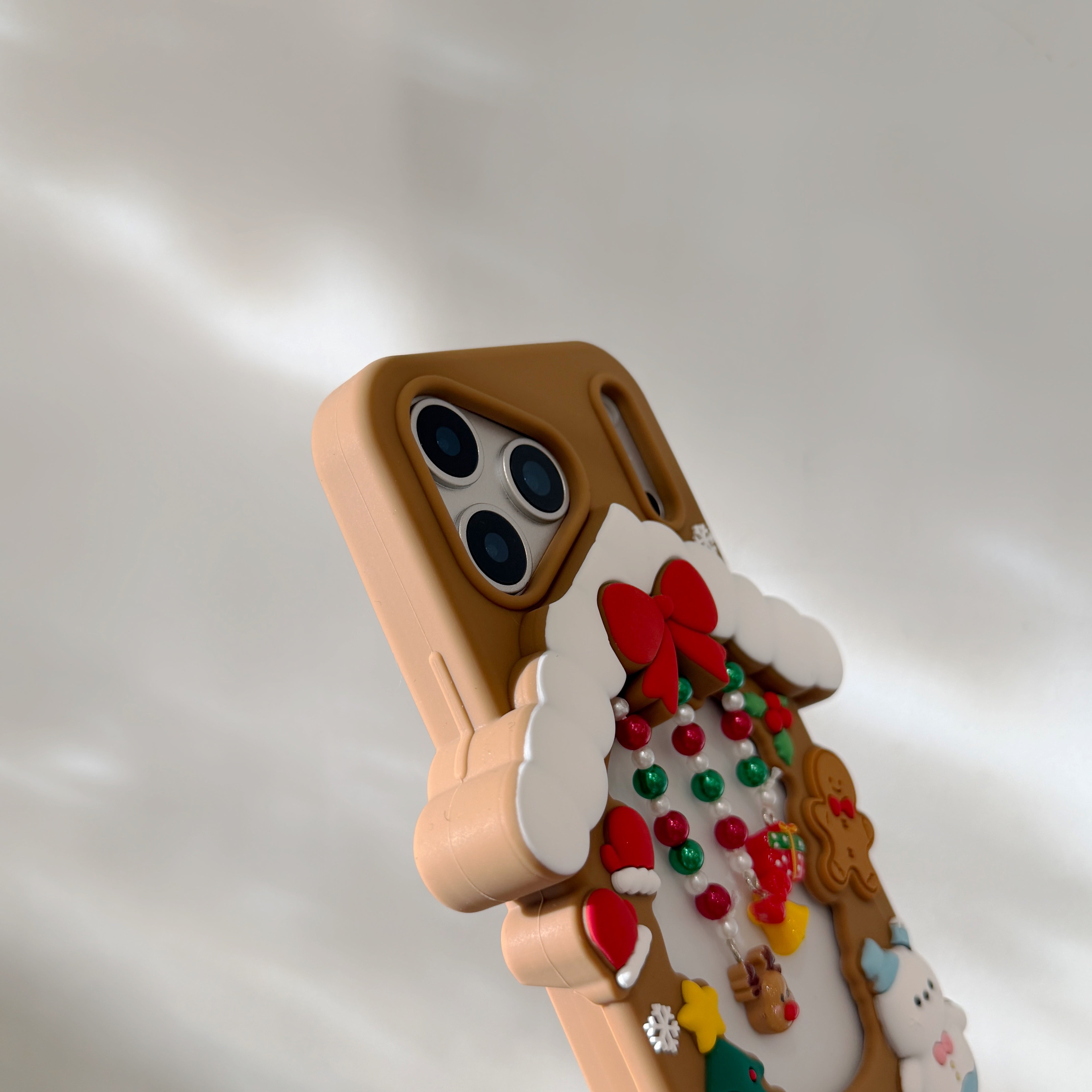 Hollowed-out Christmas cottage silicone phone case