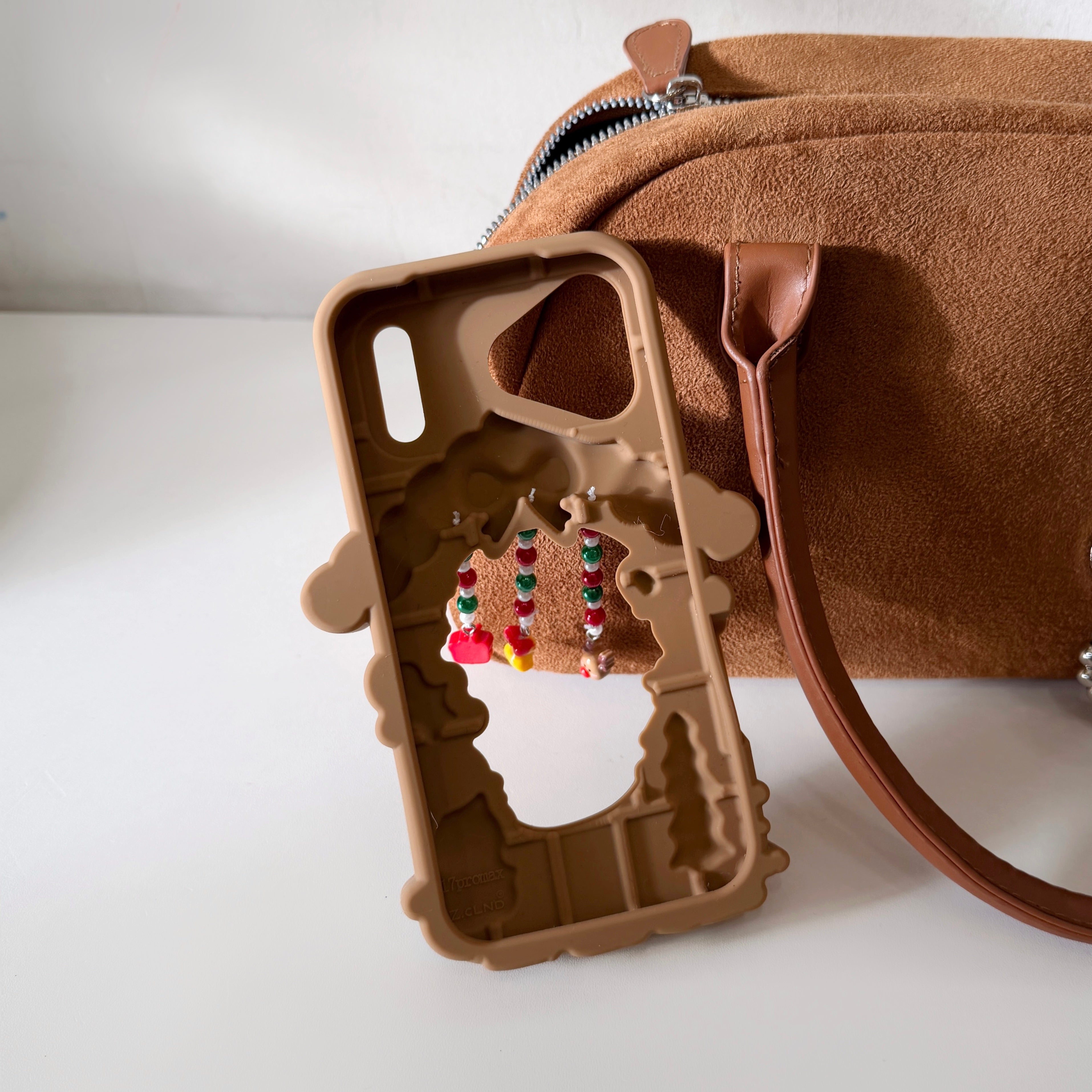 Hollowed-out Christmas cottage silicone phone case