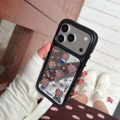 A person holding a silver metallic Hello Kitty mirror phone case against a casual background with white sneakers.