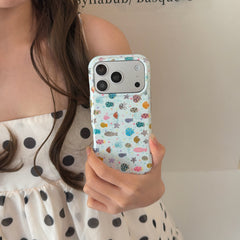 Mirror selfie of a woman showing the back of an aesthetic sea life clear phone case with a polka dot dress.