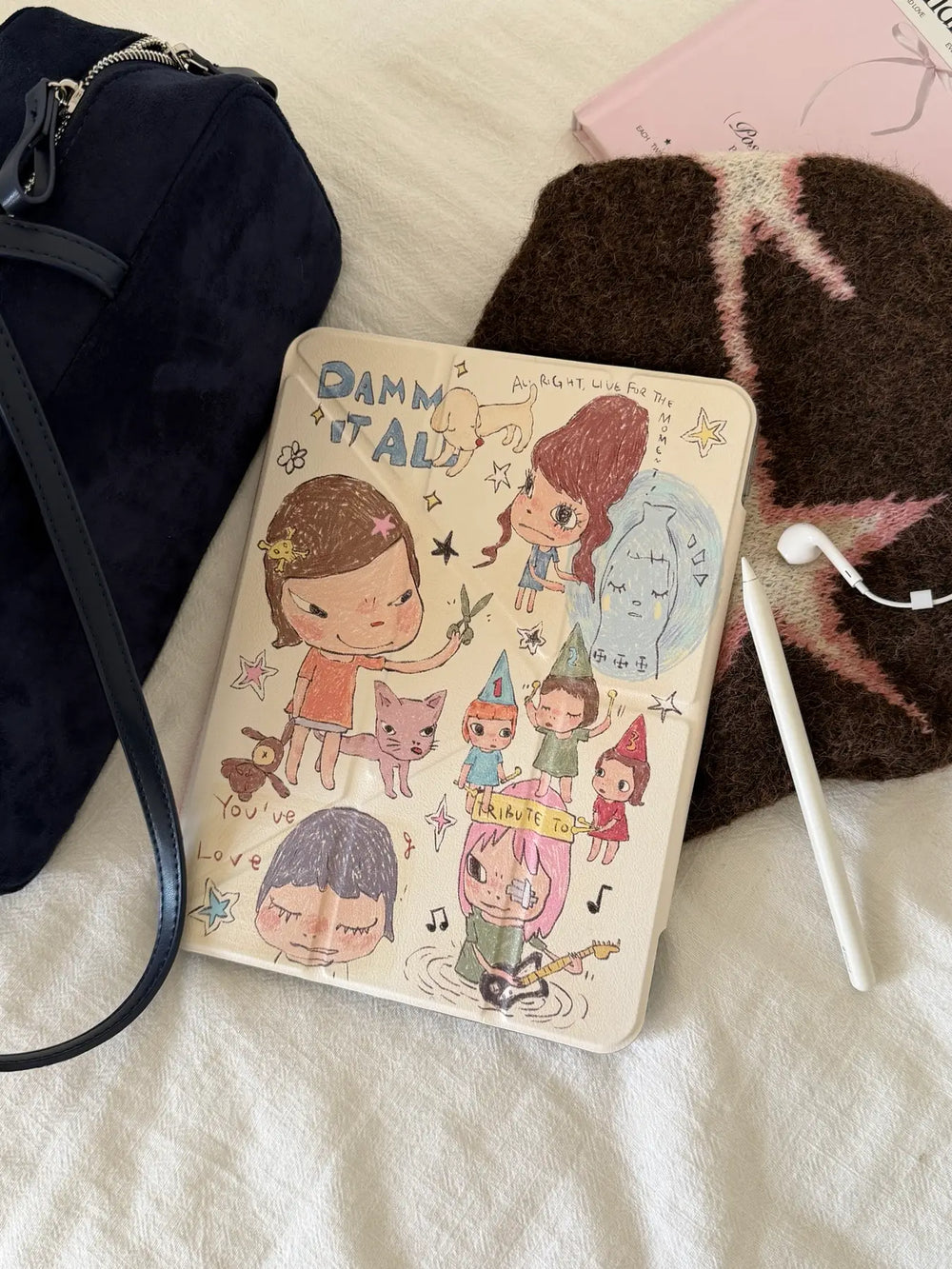 Aesthetic flat lay photography featuring a Yoshitomo Nara iPad case, a navy blue velvet bag, a brown star-patterned beanie, and an Apple Pencil.
