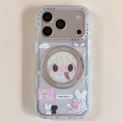 A clear Y2K anime phone case propped up horizontally on a wooden desk using its open silver ring stand.