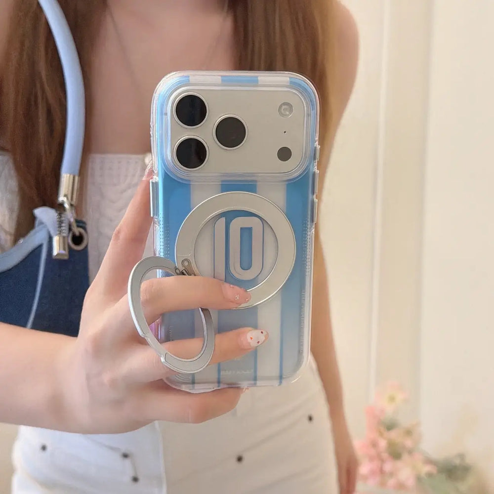 Hand holding an Argentina No 10 stripe phone case with an open silver ring finger grip.