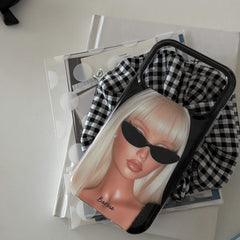 Y2K blonde girl iPhone case styled with books and gingham fabric.