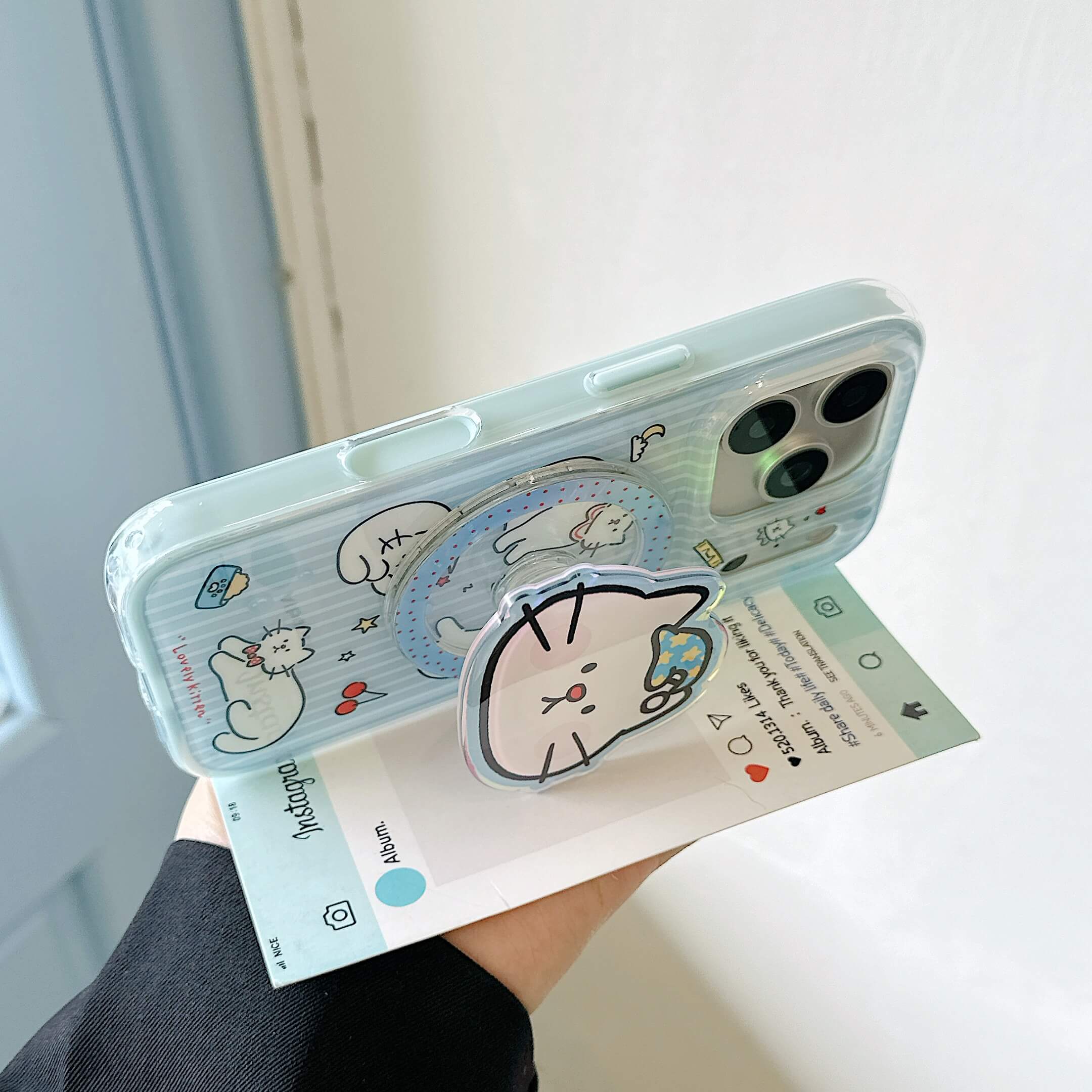 Cat iPhone case using the expandable grip as a stand.