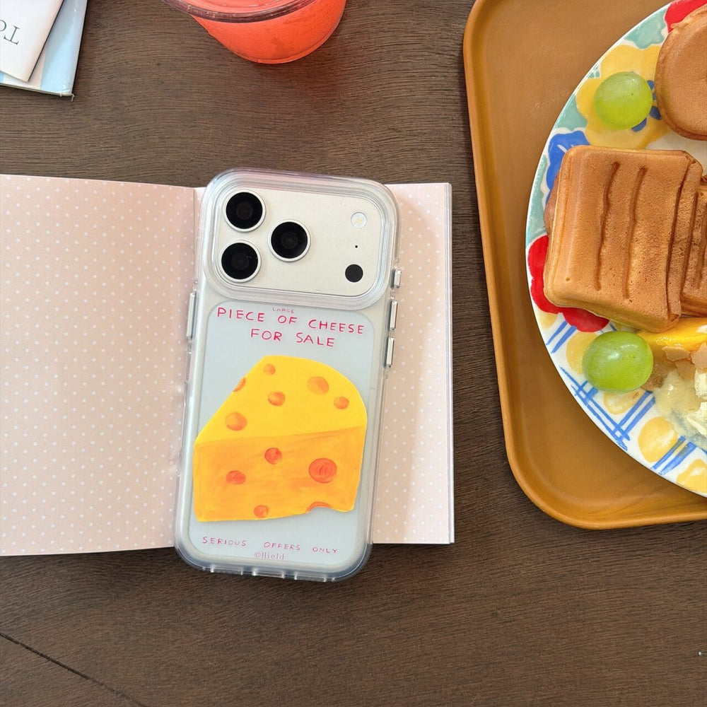 Cheese graphic clear iPhone case beside cafe dessert tray