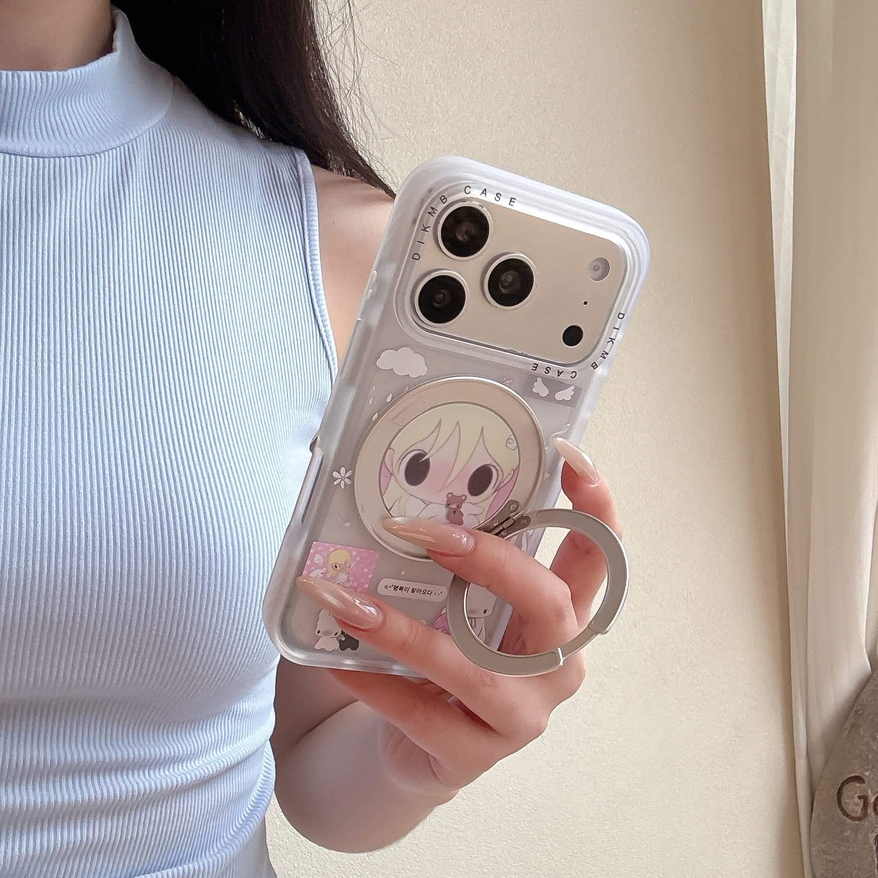 An anime girl kickstand iPhone case leaning against a decorative stone near a bright window sill.